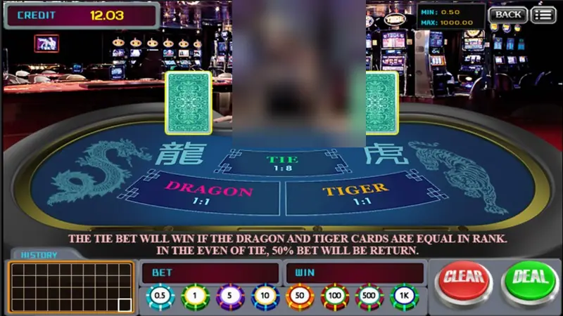 Dragon Tiger table before the deal, two face-down cards, CREDIT 12.03 and the CLEAR and DEAL buttons lit