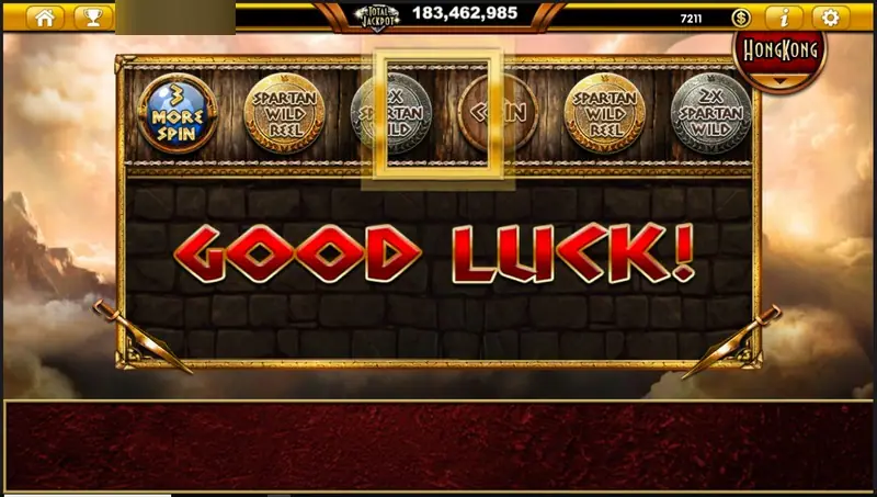 Sparta Legacy shield reel sliding, with GOOD LUCK in red on a stone wall and a gold frame over the middle shield